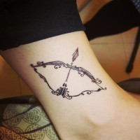 Elegant bow and arrow Sagittarius symbol designed ankle tattoo