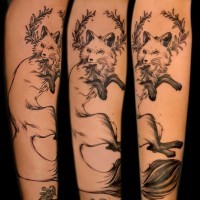Elegant fox forearm tattoo by Maud Dardeau