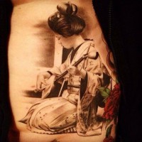 Elegant geisha playing a musical instrument tattoo on back
