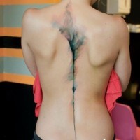 Elegant watercolor tattoo on back for girls