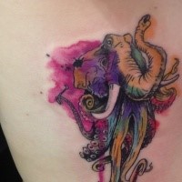 Elephant's head with octopus legs colored tattoo in watercolor style