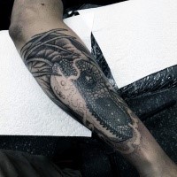 Engraving style black and white forearm tattoo of detailed dinosaur