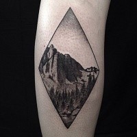 Engraving style black and white leg tattoo of big mountain