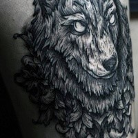 Engraving style black and white thigh tattoo of steady wolf