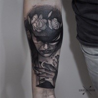 Engraving style black ink arm tattoo of mysterious face with flowers
