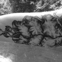 Engraving style black ink arm tattoo of creepy face with skulls