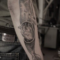 Engraving style black ink arm tattoo of big whale with human heart