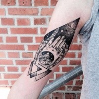 Engraving style black ink arm tattoo of human hands with lighthouse and night sky