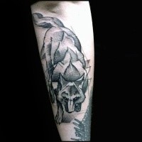 Engraving style black ink arm tattoo of wolf