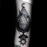 Engraving style black ink arm tattoo of big globe with sun and moon