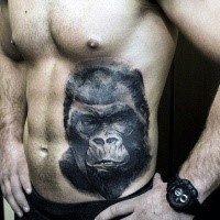 Engraving style black ink belly tattoo of big gorilla head