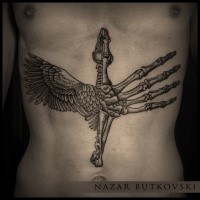 Engraving style black ink belly tattoo of flying bird skeleton