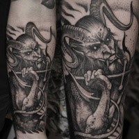 Engraving style black ink forearm tattoo of devil with cross