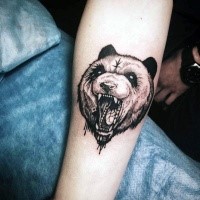 Engraving style black ink forearm tattoo of mystical bear with symbol