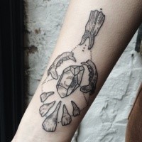 Engraving style black ink forearm tattoo of stones and bones