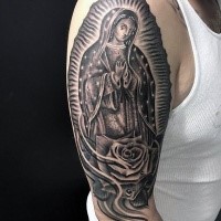 Engraving style black ink shoulder tattoo of big statue with rose