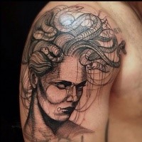 Engraving style black ink shoulder tattoo of Medusa head with snakes