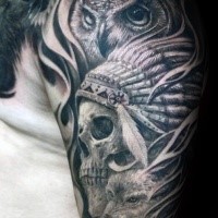 Engraving style black ink shoulder tattoo of owl with Indian skull and helmet