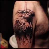 Engraving style black ink shoulder tattoo of eagle head with black triangle