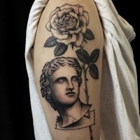 Engraving style black ink shoulder tattoo of big rose with vintage statue