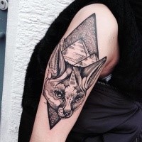 Engraving style black ink shoulder tattoo of fox head with pyramids