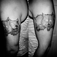 Engraving style black ink shoulder tattoo of creepy dogs