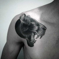 Engraving style black ink shoulder tattoo of black panther head