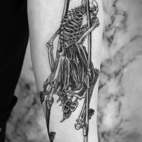 Engraving style black ink tattoo of human skeleton with spike