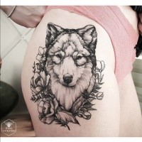Engraving style black ink thigh tattoo of wolf with flowers