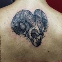 Engraving style black ink upper back tattoo of small goat head with heart