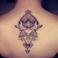 Engraving style black ink upper back tattoo of lotus flower with ornaments by Caro Voodoo