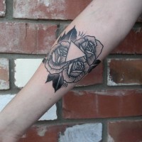 Engraving style black ink usual roses tattoo on forearm with little triangle