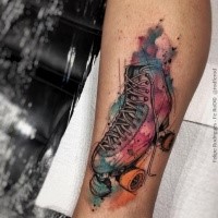 Engraving style colored leg tattoo of vintage roller