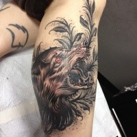 Engraving style colored leg tattoo of demonic wolf with plants