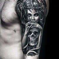Engraving style colored shoulder tattoo of woman with skull and vine