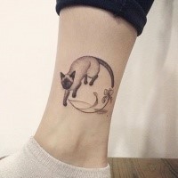 Engraving style interesting looking ankle tattoo of cat with flowers