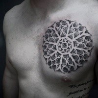 Enormous circle shaped chest tattoo of big floral ornament