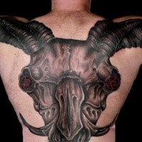 Enormous colored back and shoulders tattoo of demonic goat skull