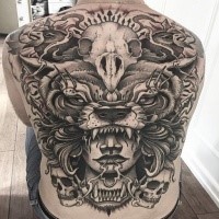Enormous mystical whole back tattoo of ancient man with animal skull helmet
