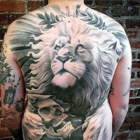Enormous stone like whole back tattoo of big lion head with human skull