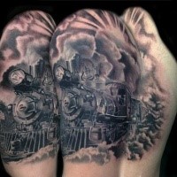 Enormous very detailed upper arm tattoo of train with clouds of steam