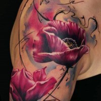 Excellent colored big flowers tattoo on shoulder with metamorphosis lines