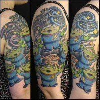 Excellent painted and colored funny cartoon aliens tattoo on shoulder