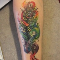 Exсiting blurred vivid-colored peacock feather tattoo on arm