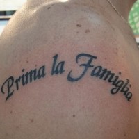 Family comes first tattoo on shoulder