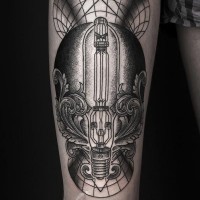 Fantastic black ink industrial tattoo on thigh