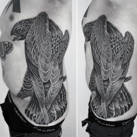 Fantastic black ink side tattoo of detailed eagle and butterfly