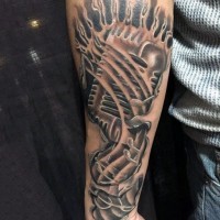 Fantastic designed black ink microphone in water tattoo on arm