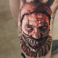 Fantastic detailed and painted creepy monster man tattoo on thigh