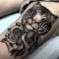 Fantastic dot style thigh tattoo of tiger head with roses